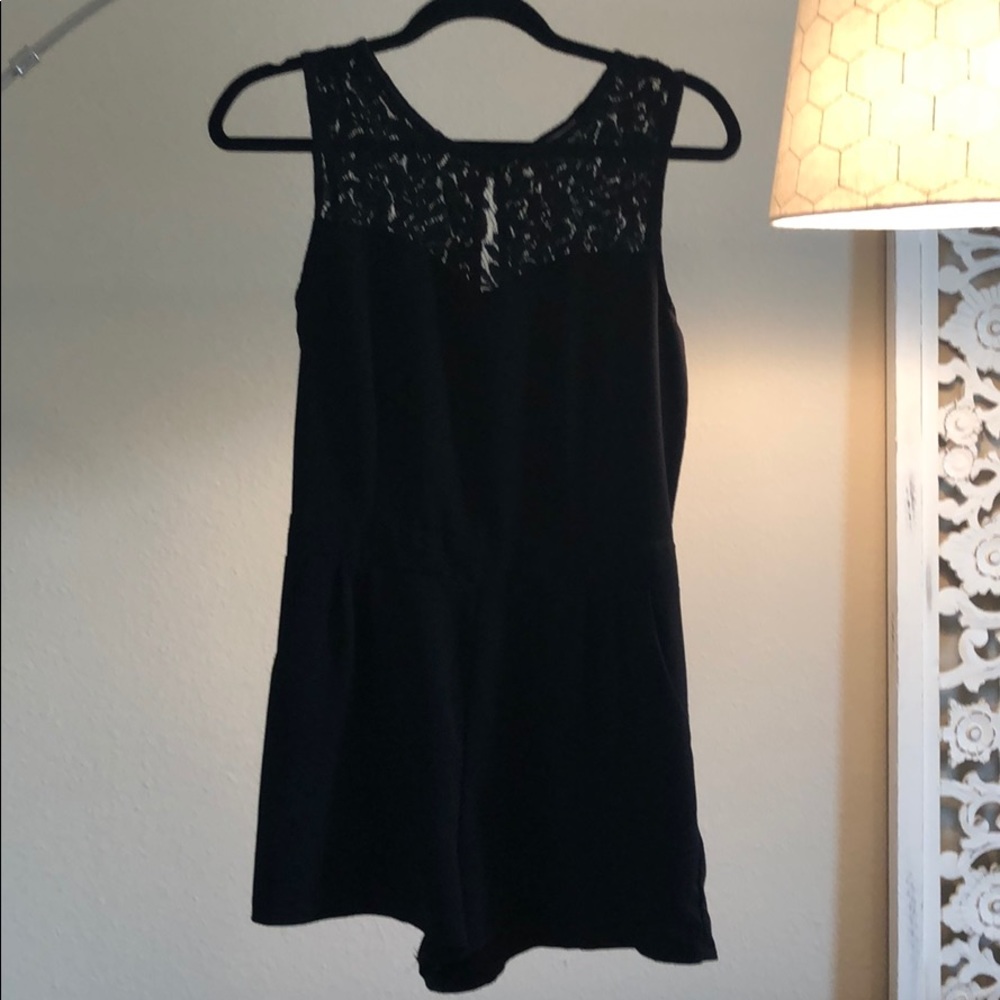 Black romper with lace neckline